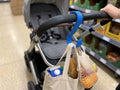 FlexiCarry buggy hook and clip attached to pram – hands-free bag holder