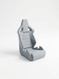 Gray racing seat with 'Recaro' branding on a white background